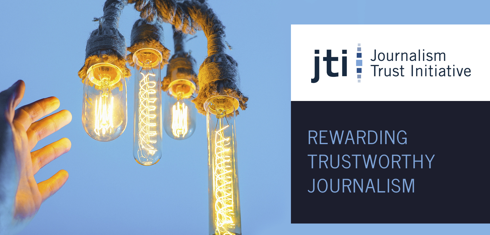 Medium blue background with light colored hand reaching toward several light bulbs. A darker blue box with the logo for the Journalism Trust Initiative and the phrase "Rewarding Trustworthy Journalism"
